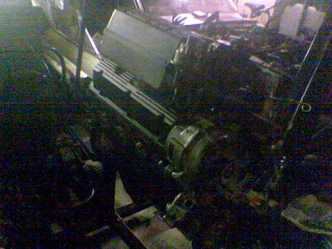 1988 Ford Bronco - The photo shows a cluttered engine compartment with various components and wiring.