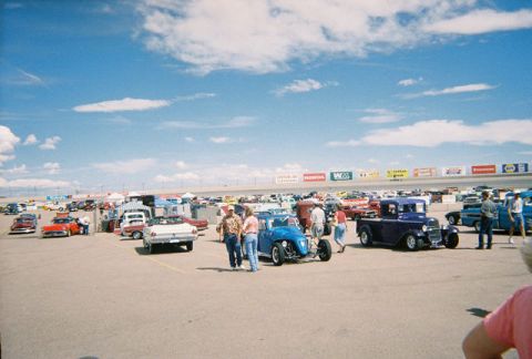 1972 Ford Ranchero - A sunny day at a car show with a variety of vintage vehicles and attendees enjoying the event.