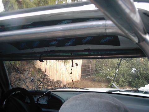 1978 Ford Bronco - Interior view of a vehicle's cabin, a roll cage and dashboard.