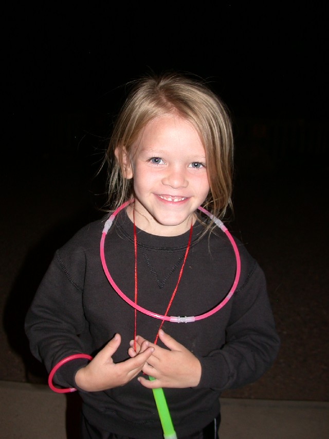 Child wearing glow necklaces