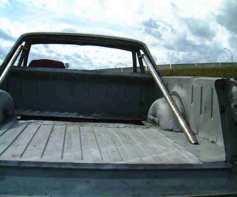 1967 Ford Ranchero - The rear bed of a 1967 Ford Ranchero pickup truck features a chrome roll bar.