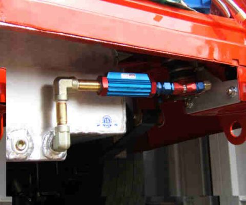 1967 Ford Ranchero - Close-up of a fuel filter and lines, likely part of a custom setup.