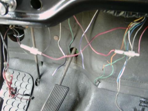 1971 Ford F-100 - The interior electrical wiring harness is exposed, showing a complex network of colorful wires.