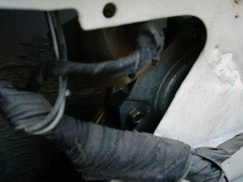 1988 Ford Bronco - Detail of wiring and a bracket, likely from a vehicle's interior or engine bay.