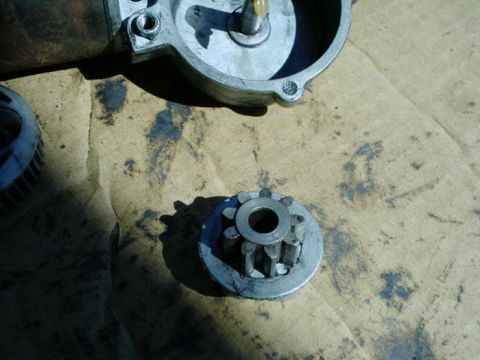 1988 Ford Bronco - Close-up of a disassembled window motor gear and housing, suggesting a repair or maintenance context.