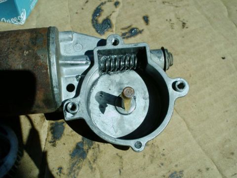 1988 Ford Bronco - Close-up of a disassembled window motor, showing internal components.
