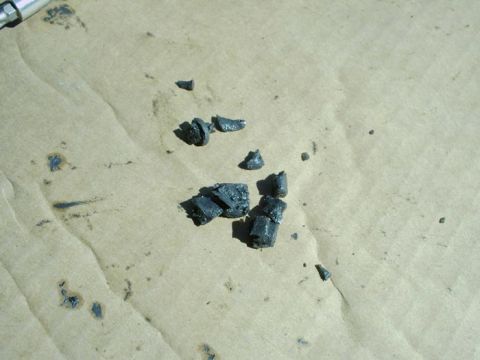 1988 Ford Bronco - These are the remnants of a broken plastic part, likely from a vehicle's interior or mechanism.