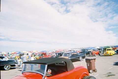 1972 Ford Ranchero - A gathering of classic automobiles at an outdoor event under a cloudy sky.