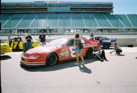 1972 Ford Ranchero - A red race car with the number 8 and Budweiser sponsorship is parked at Pikes Peak International Raceway.