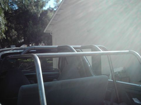 1978 Ford Bronco - Custom roll cage installed inside a vehicle's interior.
