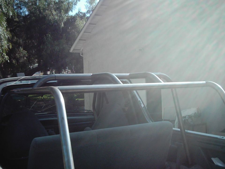 Interior view of a vehicle with a custom roll cage installed