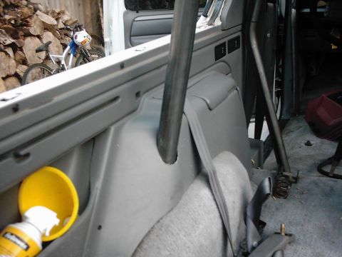 1978 Ford Bronco - The interior of a vehicle shows a roll cage and a bicycle outside, with no clear year identification.