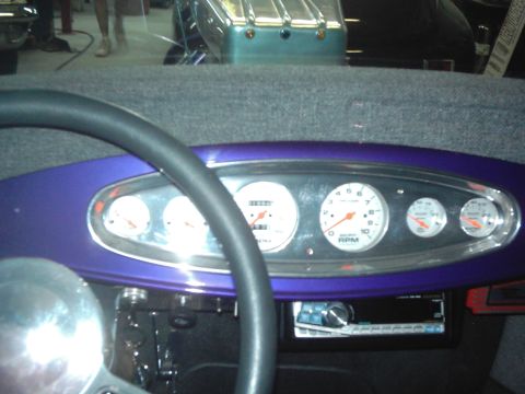 1978 Ford Bronco - Interior view of a custom dashboard with multiple gauges and a steering wheel.