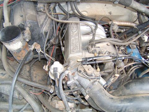 1988 Ford Bronco - Close-up of a Ford electronic fuel injection system, likely from a 1988 Bronco.