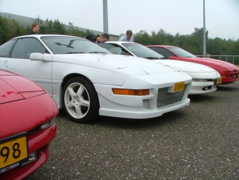 1994 Ford Probe - Several cars are lined up, with a white Toyota MR2 in the foreground a modified front bumper.