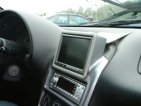 1994 Ford Probe - Interior view of a car with an aftermarket screen and stereo system installed.