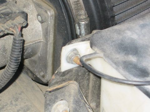 1996 Ford Bronco - for the driver's side, same song except you need to remove the radiator overflow and washer fluid bay. IE - this nut and for me a zip tie o…
