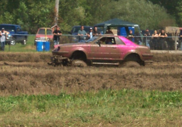 Pink coupe stuck in mud pit
