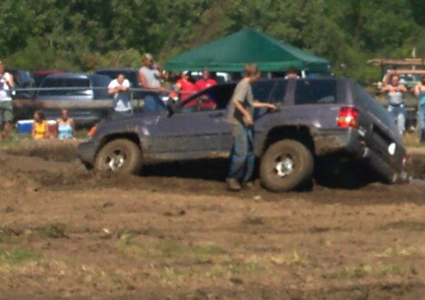 1979 Ford F-150 - Jeep Grand Cherokee stuck in mud during an off-road event.