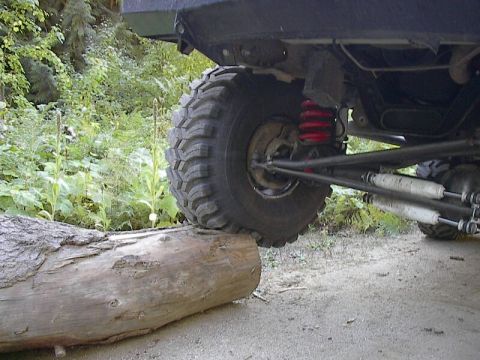 1986 Ford Bronco — Ground Hawg at 18psi flexes over log.