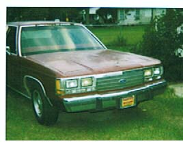 1994 Ford Crown Victoria - This 1980s Ford Crown Victoria is shown from a 3q front angle.