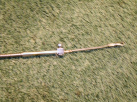 1967 Ford Ranchero - The carb end of the TV cable. The eye fits over a stud on the existing Holley linkage without any modifications. A C-clip retains the cable…