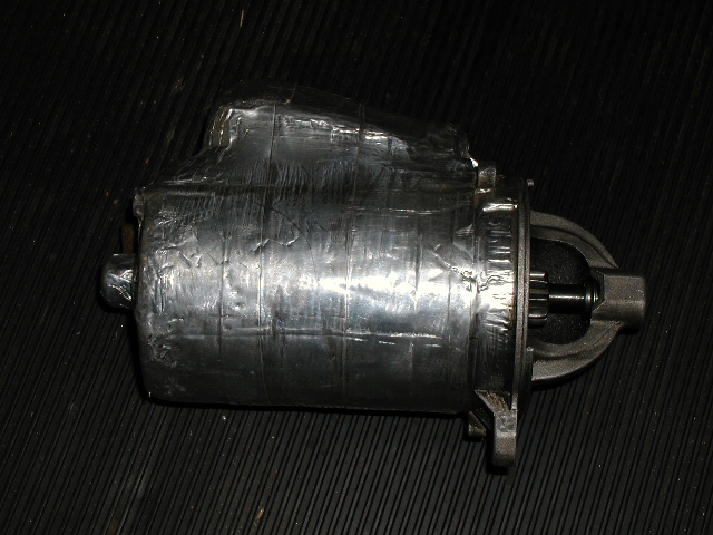 This isn't a chromed starter... It has a layer of spun ceramic insulation covered by .015 thick aluminum tape to keep the exhaust maniford from overheating it.
Zero starting problems no matter how hot the weather!