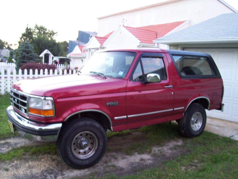 Red 1995 Ford Bronco 3/4 front view