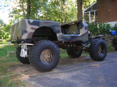 1979 Ford Bronco - This heavily modified Jeep CJ features a camouflage paint scheme and oversized tires, suggesting off-road capabilities.