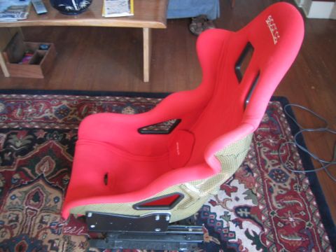 1993 Ford Probe - A red racing seat with a Sparco logo is shown, detached from any vehicle.