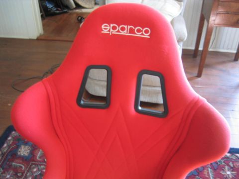 1993 Ford Probe - A red Sparco racing seat is shown, the brand name embroidered at the top.