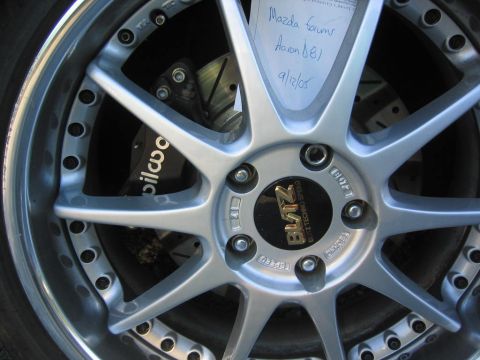 1993 Ford Probe - Close-up of a custom wheel and brake assembly, with handwritten notes on a piece of paper.