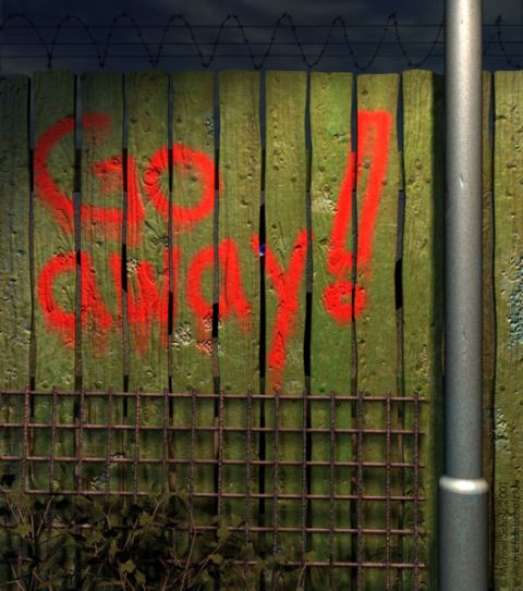 1995 Ford Bronco - A weathered wooden fence displays a stark warning in red spray paint, bordered by barbed wire and a metal pole.