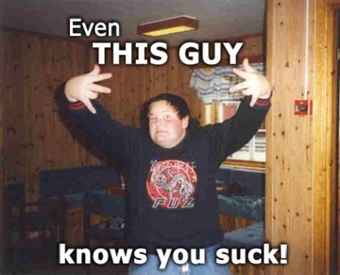 1995 Ford Bronco - A person poses with their arms raised, accompanied by text that reads 'Even THIS GUY knows you suck!'.