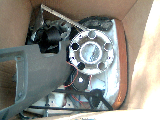 Hubcap and headlight assembly in a box