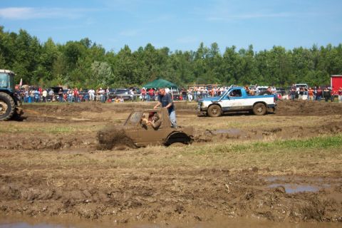 1979 Ford F-150 - Mud bogging event with spectators watching vehicles get stuck in the mud.
