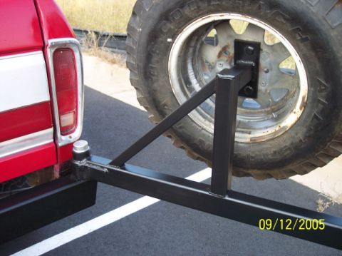 1979 Ford Bronco - A red pickup truck's rear bumper and spare tire carrier are shown, with a date stamp of 09/12/2005.