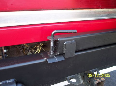 1979 Ford Bronco - Close-up of a rear bumper mount, showing exposed wiring and a date stamp from 2005.