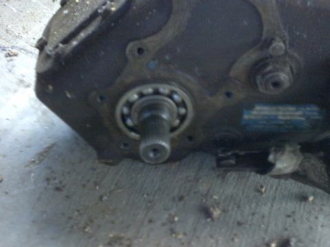 1976 Chevrolet C/K Pickup - Transmission part showing a bearing and shaft, likely from an older vehicle.