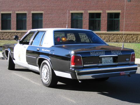 1991 Ford LTD Crown Victoria - Rear view of a black-and-white Ford Highway Patrol replica sedan showing HIGHWAY PATROL trunk lettering and California plate 281435.