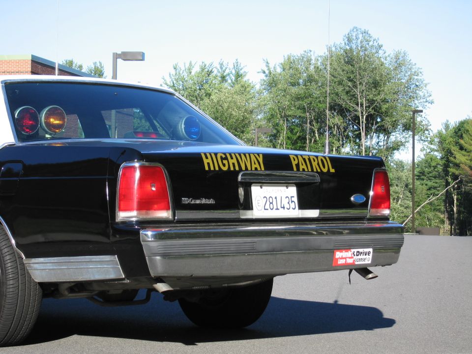 Close rear view of a Highway Patrol sedan trunk with LTD Crown Victoria badge