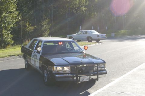 1991 Ford Crown Victoria - A 1991 Ford Crown Victoria police car is seen from the front, with a second white car in the background.