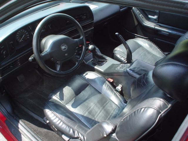 Black leather interior of a Thunderbird Super Coupe with SC steering wheel