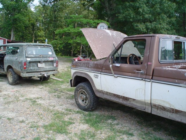 Brown and white pickup truck, 3q-front view. F-150 badge visible