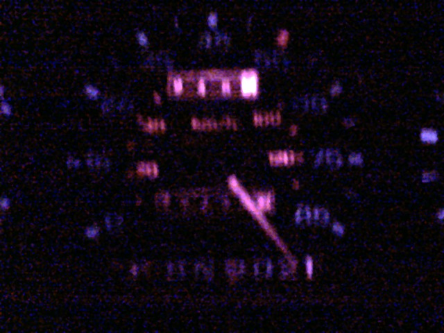 Blurry night shot of a glowing speedometer and odometer in a 1990 Ford Ranger dash