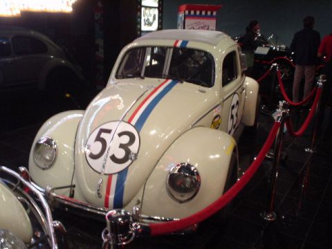 1968 Ford Mustang - A famous movie car, Herbie the Love Bug, is displayed behind a velvet rope barrier.