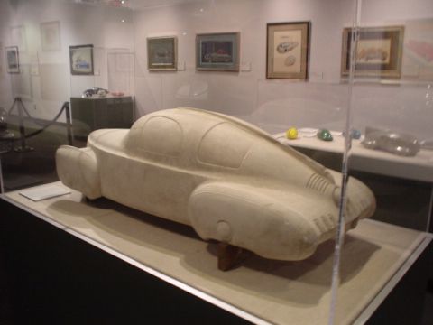 1968 Ford Mustang - A clay model of a car is displayed in a museum exhibit, its aerodynamic design.