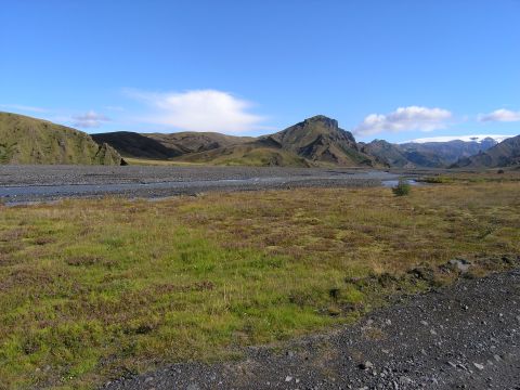 2001 Jeep Wrangler - A vast, natural landscape unfolds with a river winding through a valley towards distant, mountains.