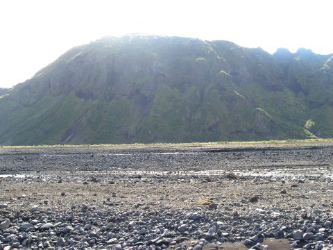 2001 Jeep Wrangler - Mountain landscape with a rocky riverbed in the foreground.
