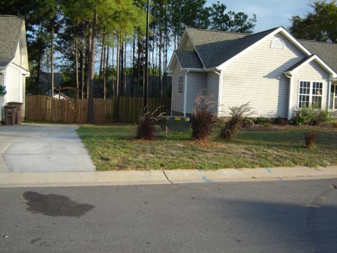 1986 Ford Bronco - A suburban house is shown with a driveway and surrounding landscaping.